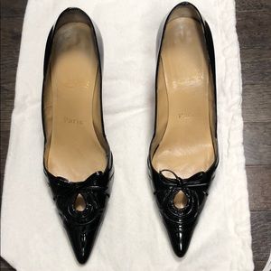 Black patent leather heels.